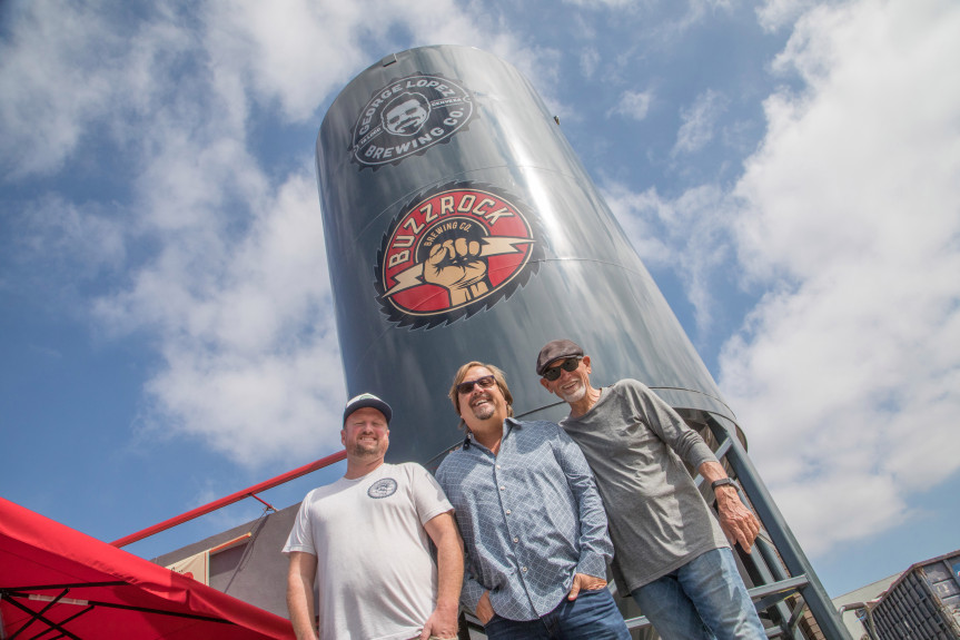 Head Brewer Justinian Caire, primary owner Michael Zislis and Dave Furano in the front of the breweries silo